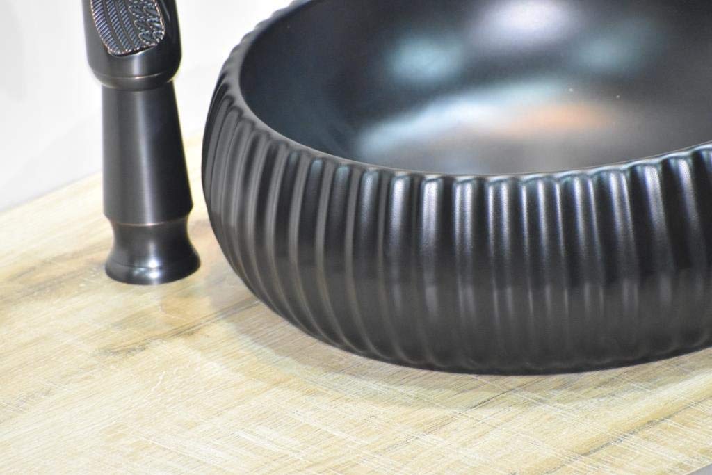 Vanity and vessel sink side profile showing round ceramic bowl sink for the bathroom in matte black