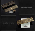 InArt brass linear shower floor drain showing removable insert for odor trap and pest blocking