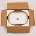 Bathroom vanity with raised sink look: gold rectangular ceramic vessel sink and vanity setup