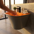 Wall mounted sink ceramic integrated half-pedestal shroud concealing plumbing side view