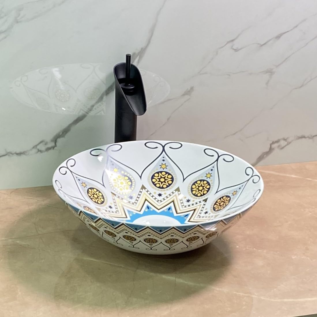 Mexican hand painted sink close-up of glossy blue yellow Talavera pottery pattern on ceramic round basin