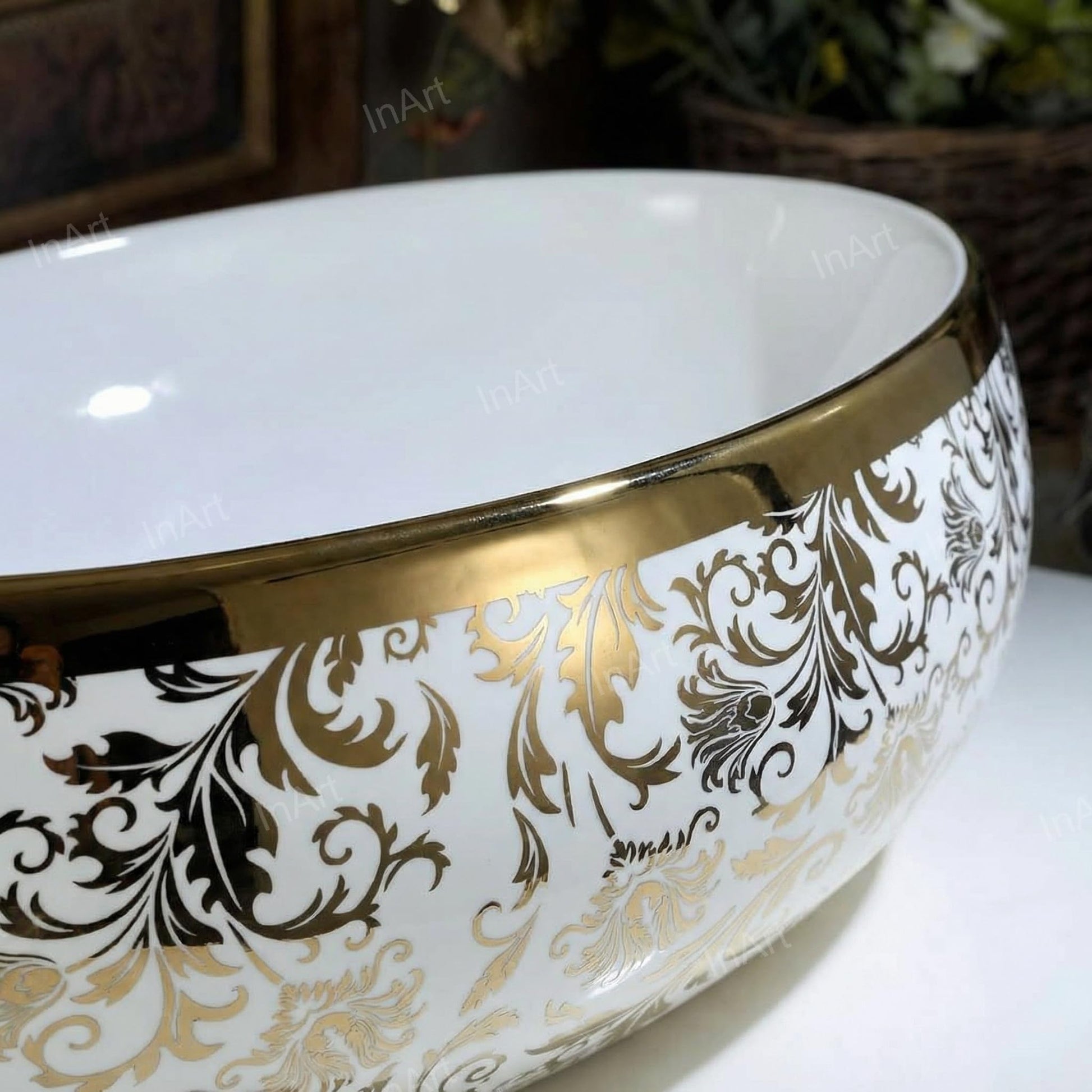 Vessel sink in bathroom vanity setup, modern sink above counter in glossy white with gold accent