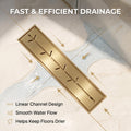 Brushed gold linear floor drain installed in a modern shower setting