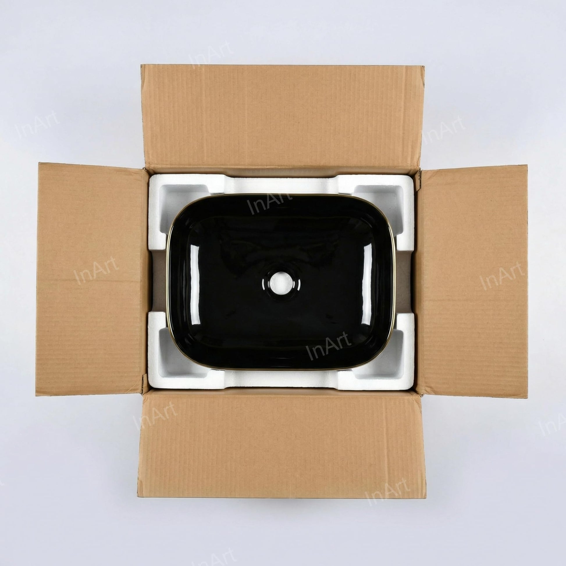Modern bathroom vanity vessel sink look, rectangular ceramic basin in black gold on countertop with faucet