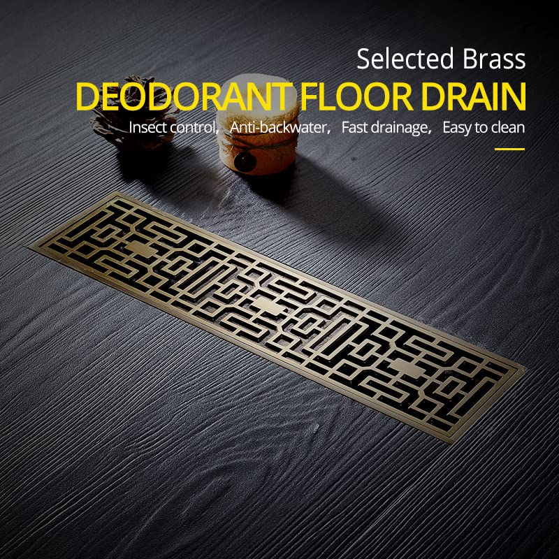 InArt antique brass brass linear floor drain showing center outlet and recessed tile-in installation profile