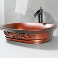 Top-down view of oval ceramic counter top sink, matte copper modern vessel sink for sink counter top