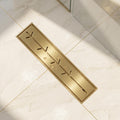 InArt brushed gold 12-inch linear shower drain with branch-slot grate