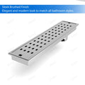 Exploded view of stainless steel linear shower drain showing removable grate, hair strainer basket, and odor trap insert