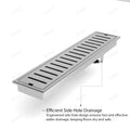 Installed look: flush tile shower floor with brushed stainless steel linear drain grate