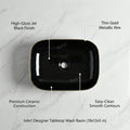 Rectangular ceramic bathroom sink, glossy black and gold vessel sink on vanity, front angle view
