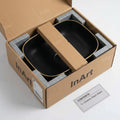 Drain opening detail on matte black ceramic rectangular vessel sink, above counter bathroom sink