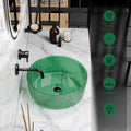 Top view of green glass bowl sink, modern bathroom vessel sink with round shape and glossy sheen