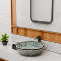 Bath bowl sink interior detail, smooth glazed ceramic round vessel basin with glossy light blue patterned finish