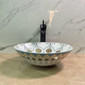 Talavera vessel sink side angle showing round ceramic bowl and hand painted Mexican design finish