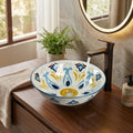 Faucet for vessel sink pairing on round ceramic Mexican blue basin, countertop installation detail