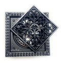 Installed look of matte black brass square shower drain cover on tile shower floor