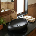Rectangular vessel sink close-up, matte black ceramic basin with smooth rim for modern style sink setup