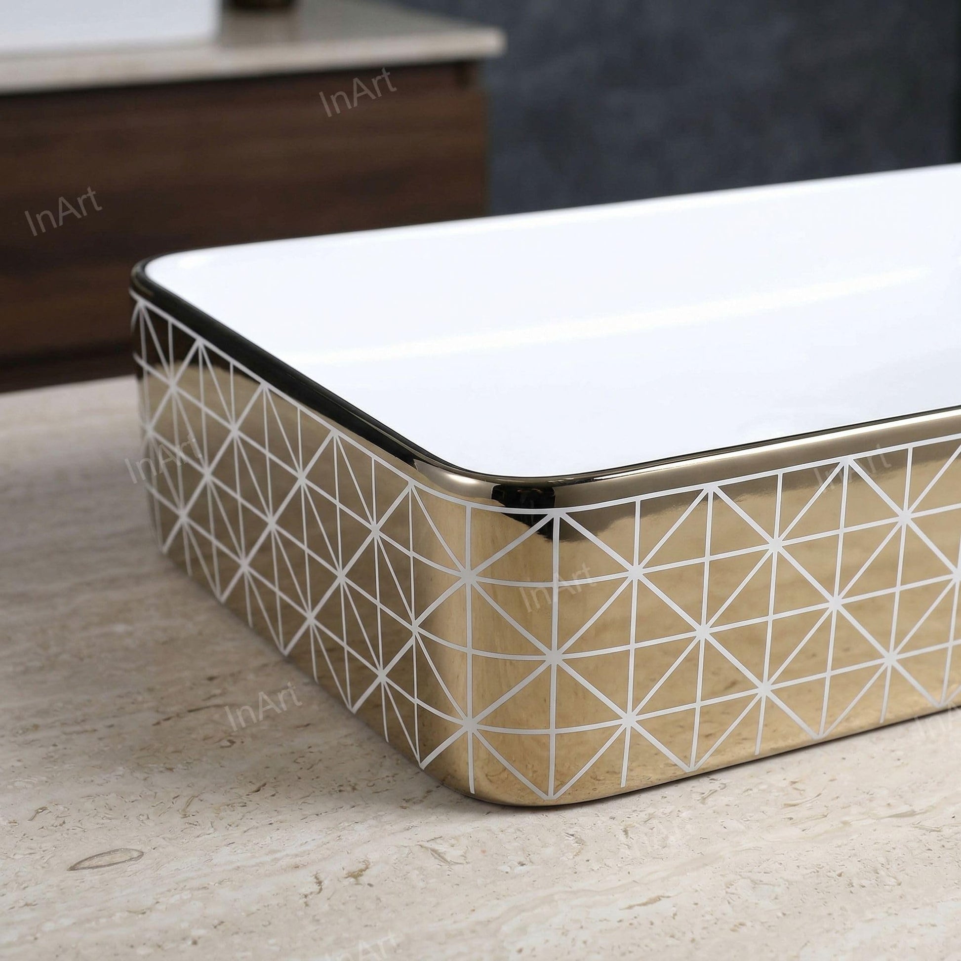 InArt ceramic wash basin on vanity, rectangular glossy gold vessel sink paired with vessel sink faucets gold