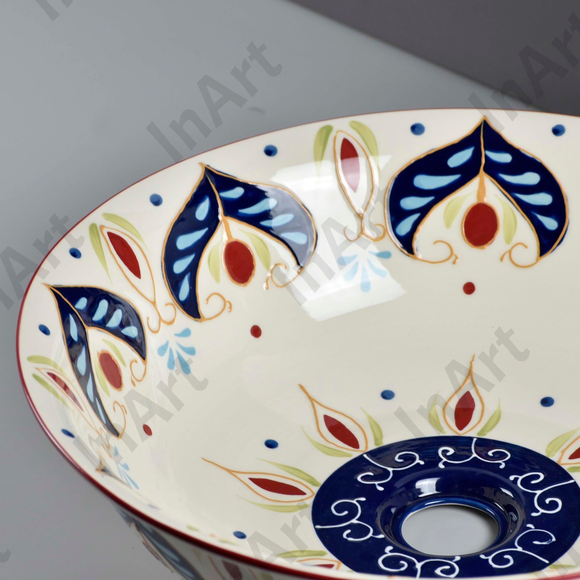 Close-up of beige blue artistic pattern on ceramic round sink bowl bathroom, smooth glazed finish detail