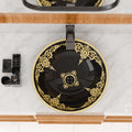 Detail of smooth rim and drain opening on round ceramic countertop vessel sink bowl, black gold