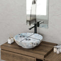 Vessel sink on vanity top, angled view of round ceramic light blue glossy bath bowl sink