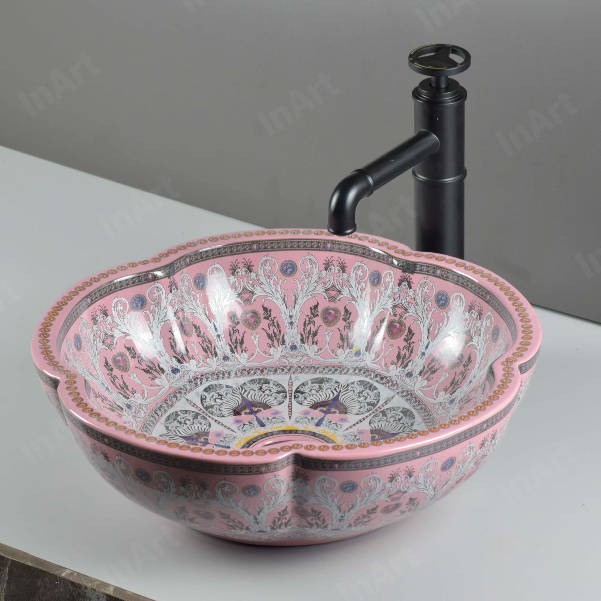 Glossy pink ceramic oval bathroom vessel sink on vanity, InArt tabletop basin bowl side angle view