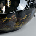 Drain opening detail on ceramic oval bath bowl sink, glossy patterned tabletop vessel sink and vanity style