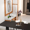 Restroom sink bowl drain opening detail, round ceramic vessel basin in glossy white floral design