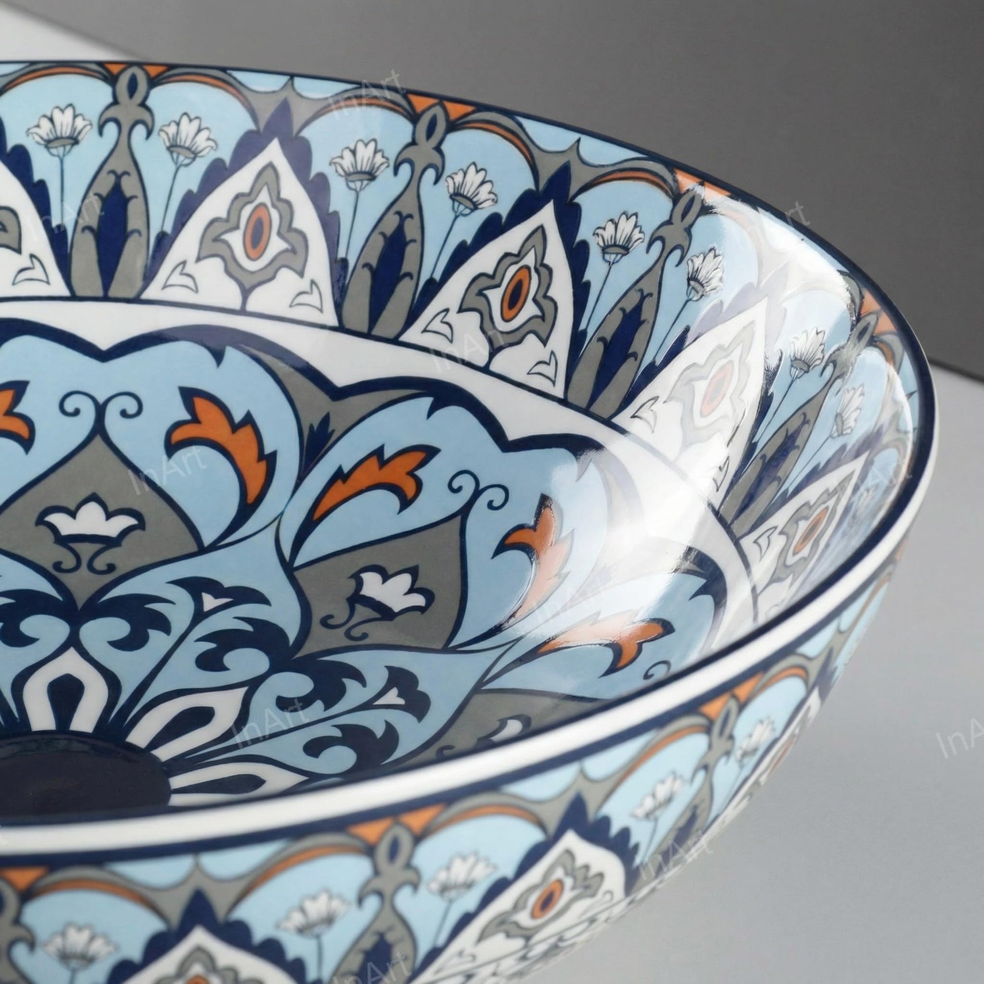 Modern vessel sink styled on vanity, round ceramic bowl sink with blue Mexican design