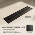 Removable branch-slot grate on the matte black linear shower drain