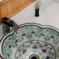 Bowl sinks for the bathroom close-up, glossy light blue patterned ceramic round wash basin rim detail