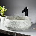 Modern style sink close-up of smooth rim and drain, InArt round ceramic sink basin in light green